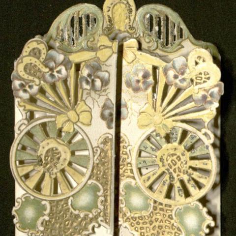 Fully closed Christmas card with intricate cut-out designs