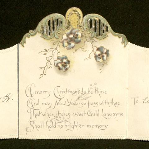 Fully opened Christmas card with intricate cut-out designs