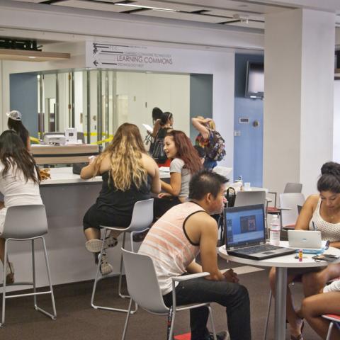 Students enjoying our new cafe seating in the Library's lobby.