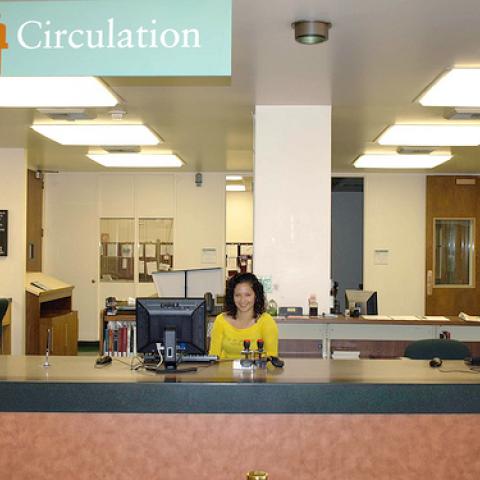 Student at the old circulation desk.