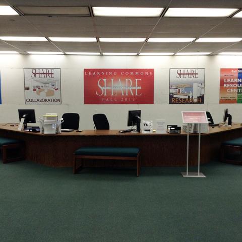 Construction going on behind the old reference desk.