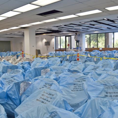 A sea of blue plastic -- unpacking our new furniture.