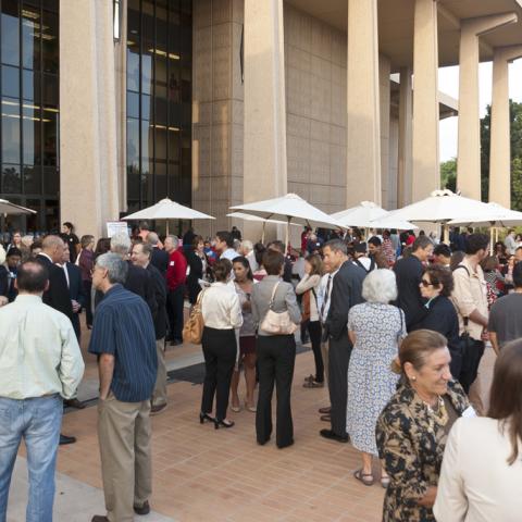 Guests populate the front of the library during the reception
