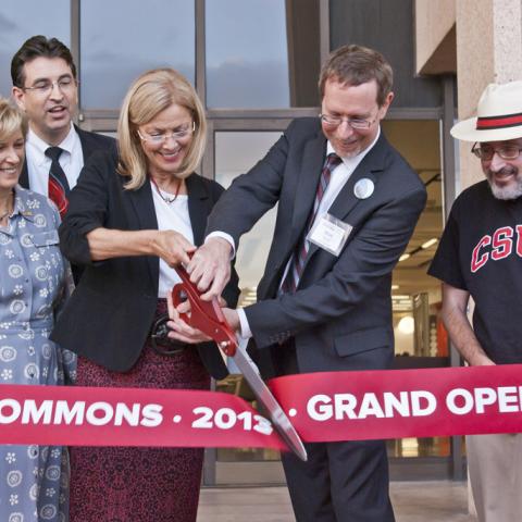 President Harrison and Dean Stover cut the ribbon.