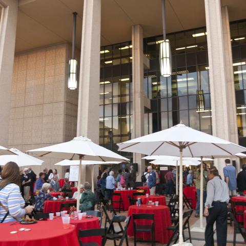 After the ribbon-cutting ceremony, guests mingle and partake in refreshments.
