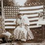 Marie in front of forty-eight star American flag, ca. 1912.