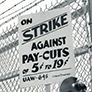 Strike against pay cuts sign