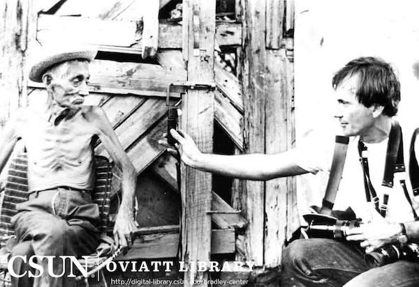 Richard Cross interviewing an elderly man