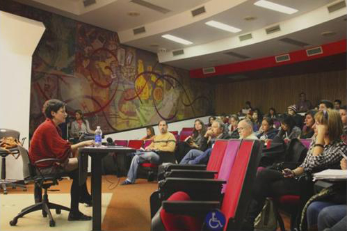 Woman speaking before a large crowd Woman speaking before a large crowd