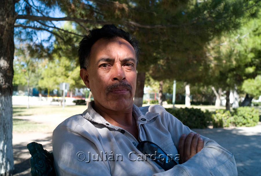 Julián Cardona sitting with his arms crossed
