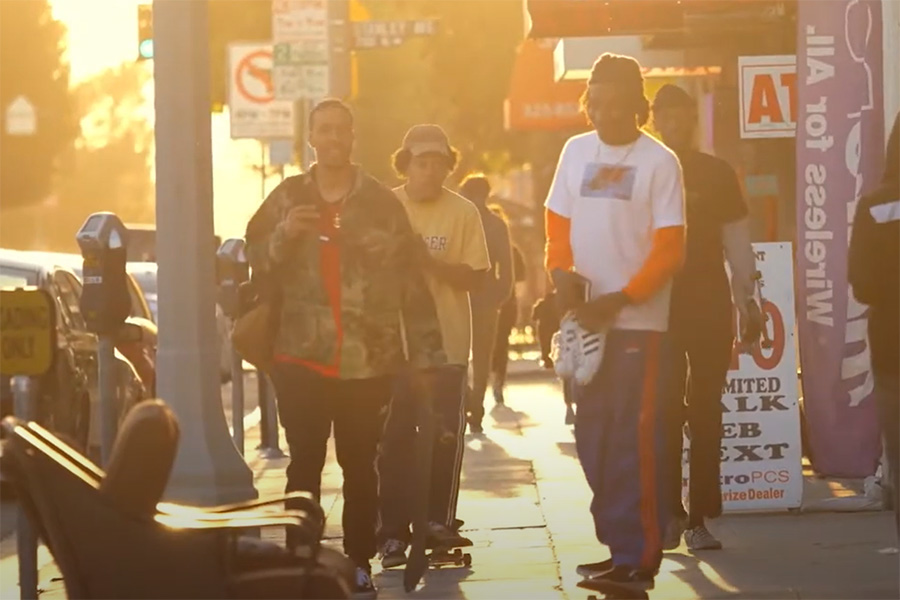 young men skateboarding on a crowded sidewalk young men skateboarding on a crowded sidewalk
