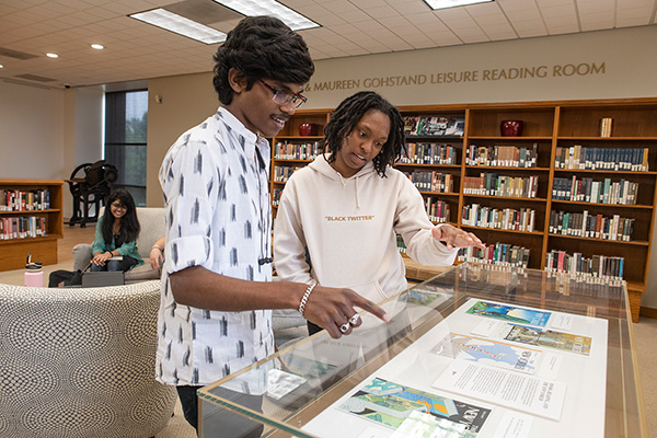 students look at display case in Gohstand reading room