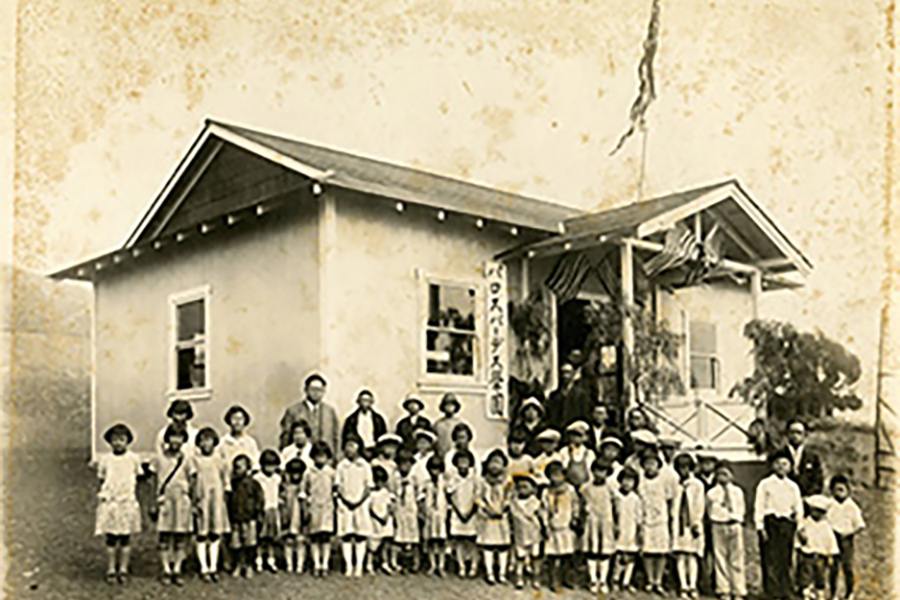 A large group of children are photographed outside of the Palos Verdes Language School and Portuguese Bend Community Center.