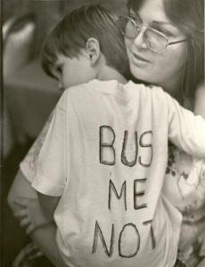 A mother holds her son at a BUSTOP campaign rally