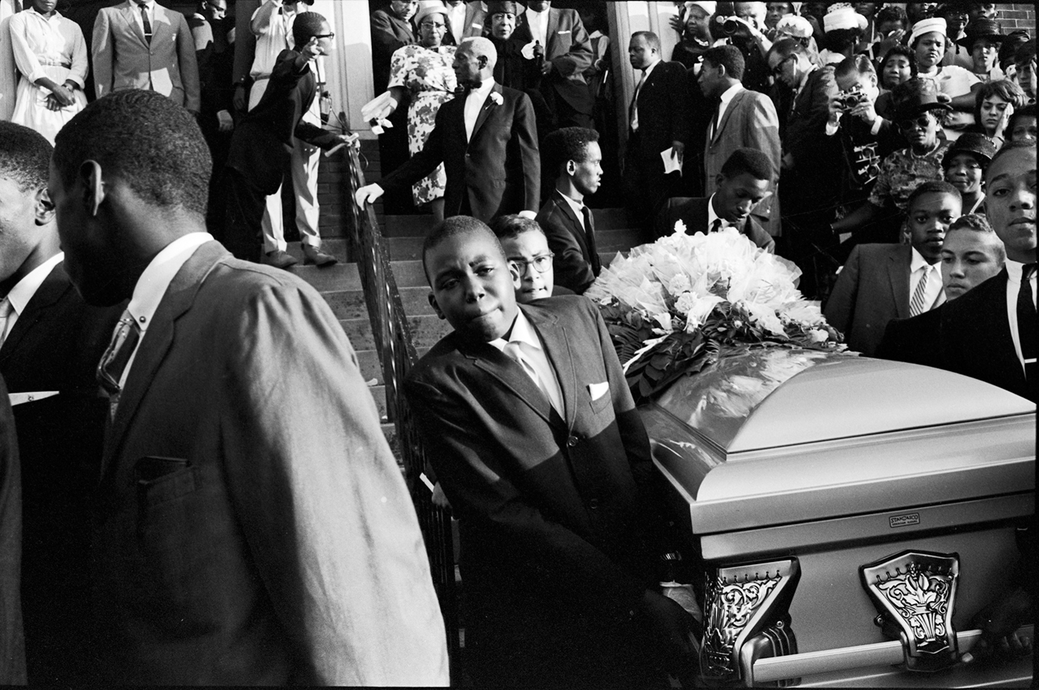 Cynthia Morris Wesley's casket carried down from the Sixth Ave Baptist Church