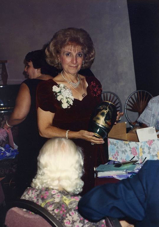 5.	Sara Chitjian holding a retirement gift, 1994, Zruhy ”Sara” Chitjian Collection, Box 108 Folder 7.