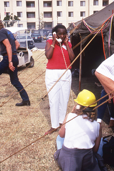 President Wilson working on reconstruction with a land line, Spring 1994, University Archives Photograph Collection, Box 46