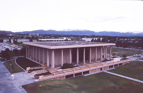 Facing northeast, the Oviatt Library ca.1975 and what is now known as the University Library Lawn is shown prior to the additions of the east and west wings and the grand staircase with the terraced side lawns. 