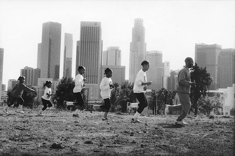 A photograph of the Holiday family jogging