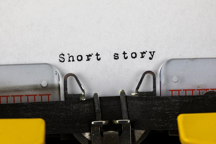 Typewriter with the words Short Story on the page