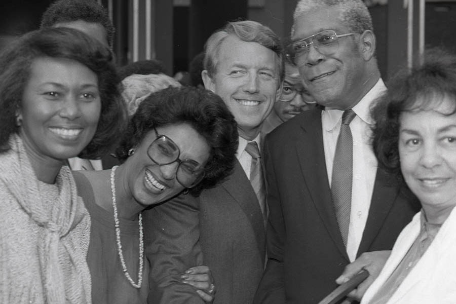 (Left to right) L.A. County Supervisor Yvonne Brathwaite Burke, Museum Director Aurelia Brooks, an unidentified man, Senator Bill Green, and Assemblywoman Teresa P. Hughes pose for a group portrait while holding a pair of giant scissors during the ribbon cutting ceremony for the California African American Museum (CAAM). 1984. Digital ID: 11.06.GC.N35.B2.17.29.07.1