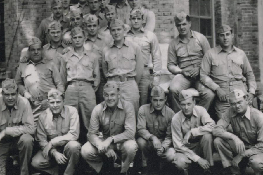 Maj. James C. Magee (front row center) poses with his battalion staff at British Embassy compound billet, Peking 1945