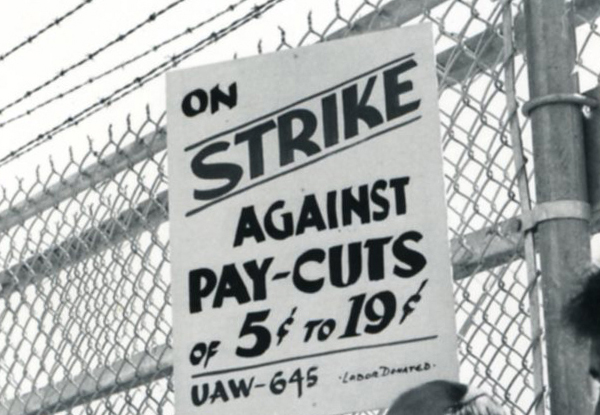 Strike against pay cuts sign