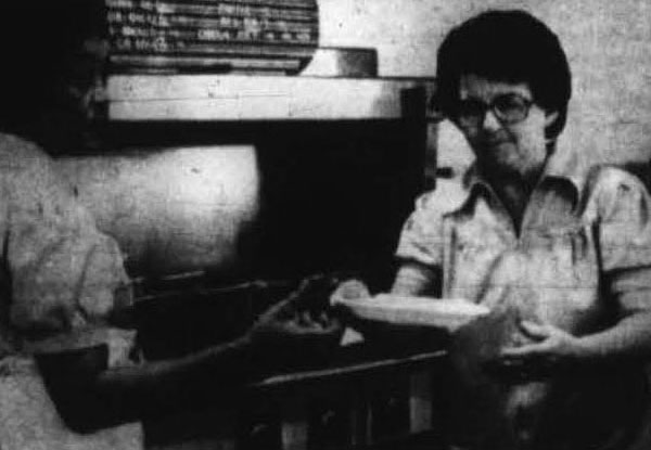 Rooftop Employee Grace Harrison filling meal orders, October 14, 1981