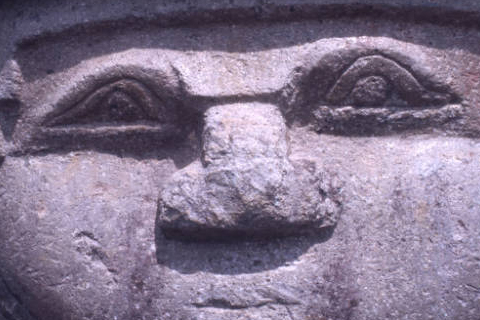 Close-up view of sculpture's face belonging to a crouching woman at the Alto de las Piedras site of San Agustín Archaeological Park. Photo taken in 1975. Digital ID: 99.01.RCr.sl.B17.04.25.13