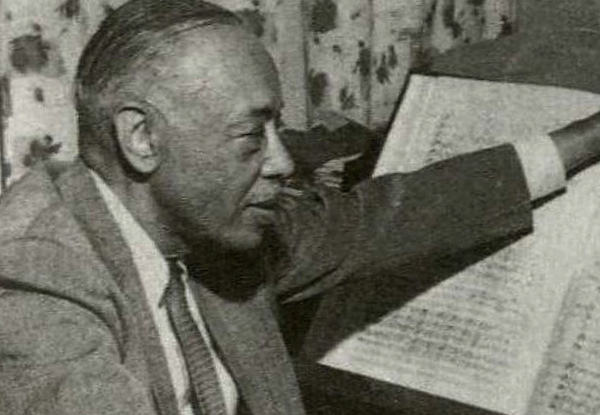 William Grant Still is shown sitting at a piano looking at a sheet of music. Central Avenue-Its Rise and Fall: Including the Musical Renaissance of Black Los Angles, Bette Yarbrough Cox, ML 3556 .C75 1996