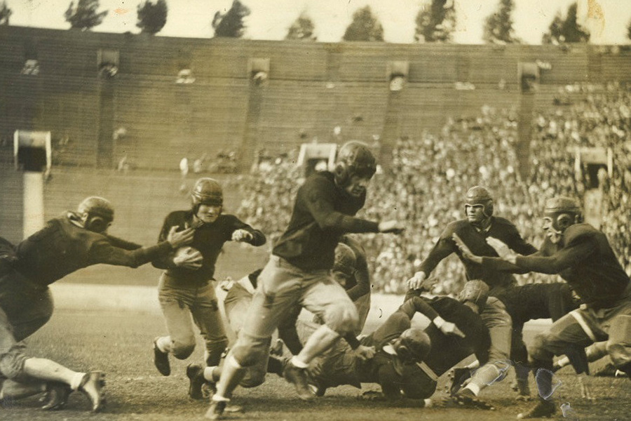 Occidental College football players in action