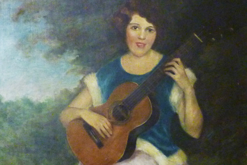 Vahdah Olcott-Bickford playing the guitar