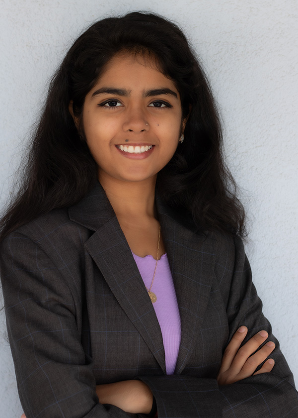 Vaishnavi Sen Profile wearing a blazer with a purple undershirt.