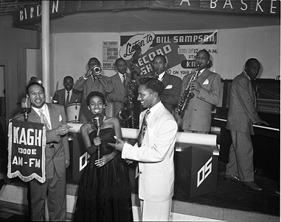 Disc Jockey Bill Sampson (left) with a band at Jack’s Basket Room nightclub. Charles Williams Collection. 09.CW.N45.02.259B