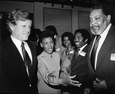 Congresswoman Maxine Waters talks with Senator Edward Kennedy (left) and LA Sentinel editor Jim Cleaver and others during a special event in Los Angeles. Digital ID: 91.01.GC.P.B1.31