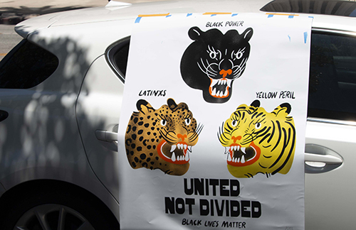 Vehicle displays poster which reads "United not divided - Black Lives Matter'', at Liberty Park during a "Ktown for Black Lives" event, Koreatown, 2020, KRT.D.B1.11.3494 