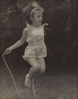 Little girl jumping rope