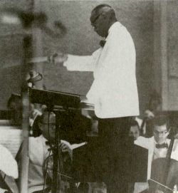 Photograph of a band leader in The Black Music History of Los Angeles...