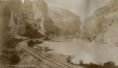 Photo of a train traveling through Eagle River Canyon