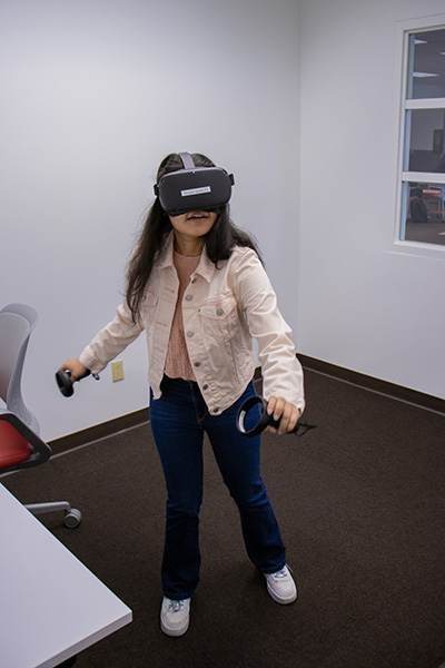 Student trying out a virtual headset