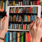 Woman Holding Tablet in Library