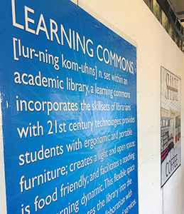 Signs on a Construction Wall Promoting the Upcoming Learning Commons