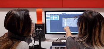 Two students using the CMS recording studio