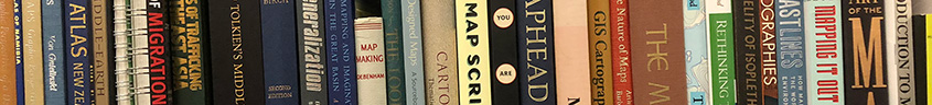 books on a shelf at the oviatt library map collection