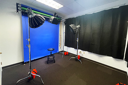 Chair in front of blue screen with studio lights