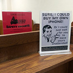 Desks with signs explaining security guidelines
