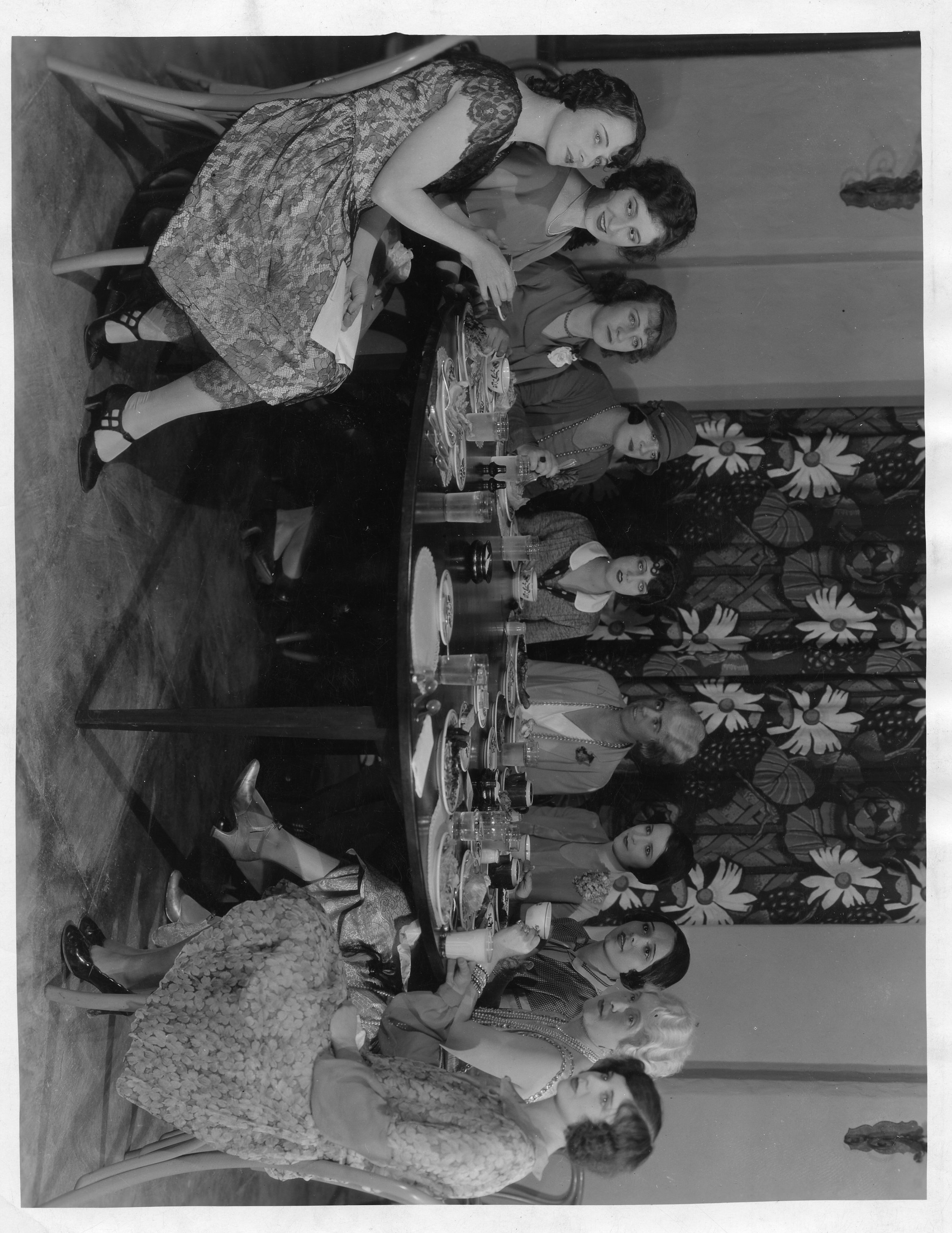 Women seated around a table for a meal