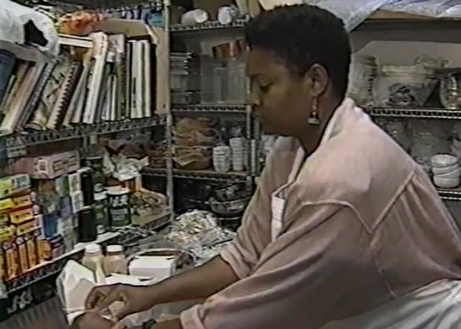 Woman in a restaurant and packing some food.